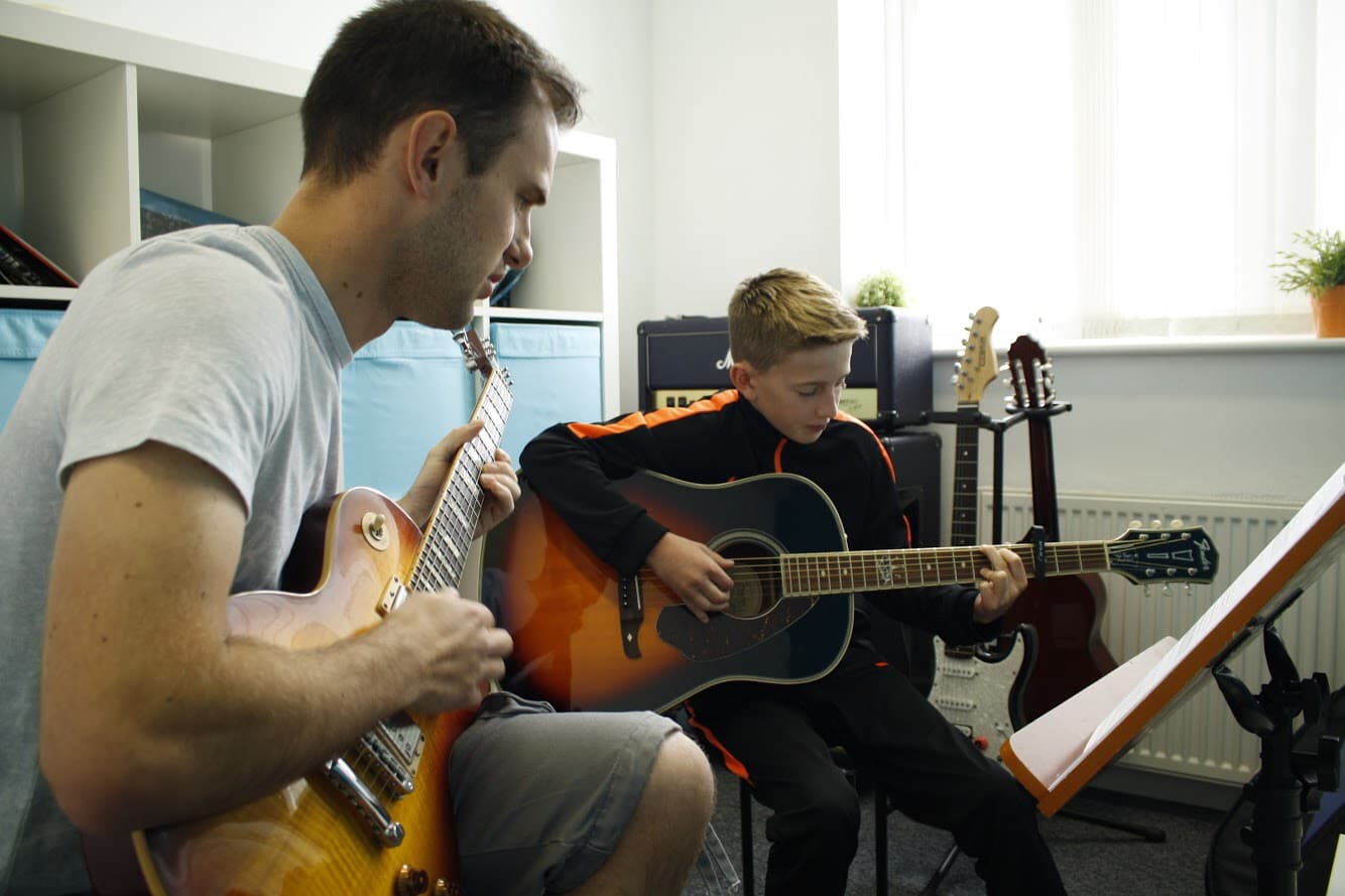 A guitar lesson at Clearwater Music
